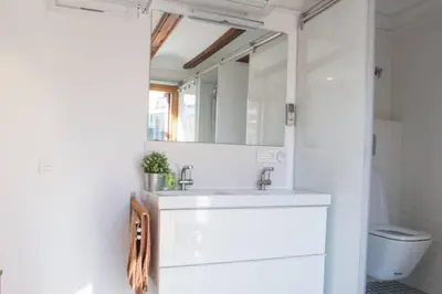 a bathroom with a sink and a mirror at Finca Reloj in Valencia