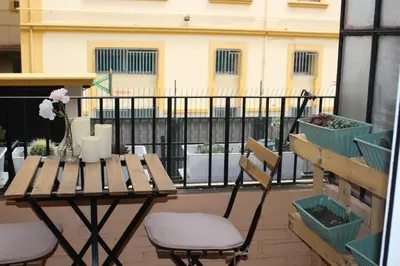 a table and chairs sitting on a balcony with a table at New Room in the beach in Valencia