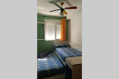 a bedroom with a bed and a ceiling fan at APARTAMENTOFAMILIAR, PLAYA, WIFI, PISCINA in Canet de Berenguer