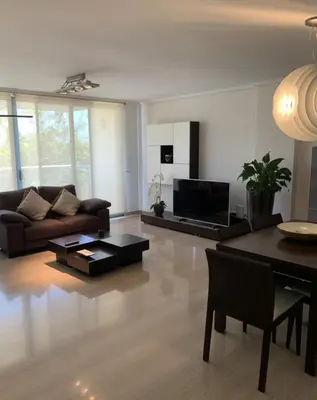 a living room with a couch and a table at Art and Sciences view luxury apartment in Valencia