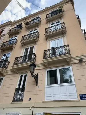 a building with white doors and balconies at Serrano Park in Valencia