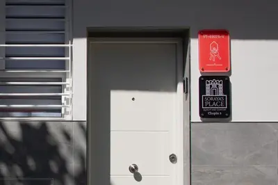 a door to a building with a sign on it at Soraya's Place - Chopín 3 in Valencia