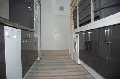 a laundry room with a washer and dryer at Soraya's Place - Chopín 4 in Valencia