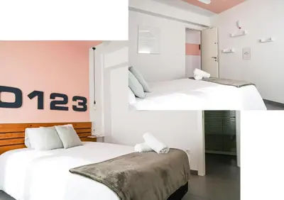 two pictures of a bedroom with two beds at Torres de Serrano Apartment in Valencia