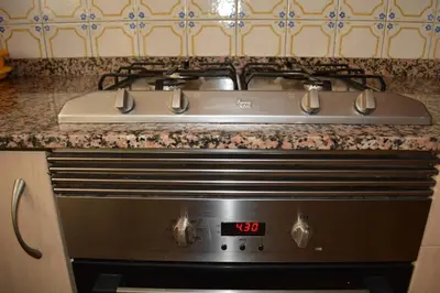 a stove top oven sitting in a kitchen at Apartemento grupo amigo o familias : blasco ibanez C in Valencia