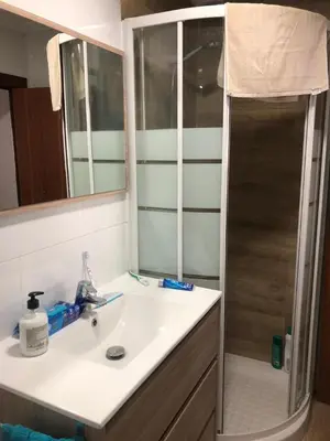 a bathroom with a sink and a shower at apartemento nuevo cerca playa para familia o amigos . isidro in Valencia