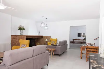 a living room with couches and a fireplace at Villa Conchin Casa junto a Parque Natural in Alberique
