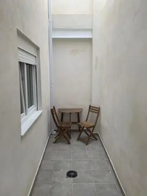 a room with two chairs and a table and a window at UIM Mediterraneo PB Segorbe Wifi in Puerto de Sagunto