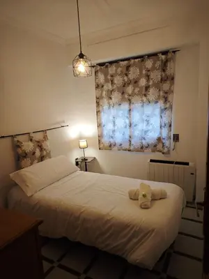 a bedroom with a bed with a stuffed animal on it at Casa MarTa in Chella