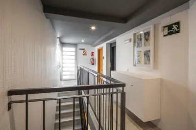 a hallway with a staircase in a building at Stancia Carmen in Valencia