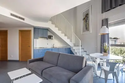 a living room with a couch and a table at Stancia Carmen in Valencia