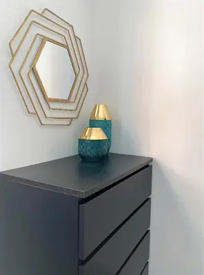 a black dresser with a mirror on top of it at UIM Mediterraneo Casita Palancia Wifi in Puerto de Sagunto