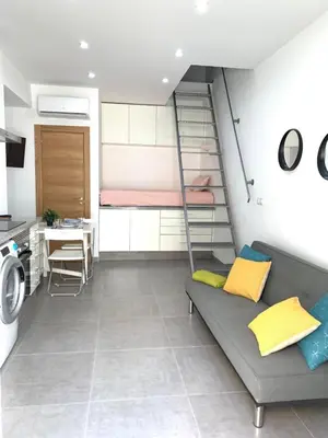a living room with a bunk bed and a kitchen at UIM Mediterraneo Casita Palancia Wifi in Puerto de Sagunto