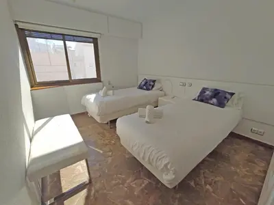 a living room with two beds and a couch at Sunny apartment with fantastic terrace views! in Valencia