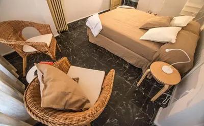 a bedroom with a bed and a table and chairs at Rotaret in Valencia