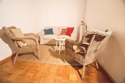 a living room with wicker chairs and a couch at Rotaret in Valencia