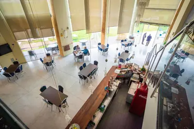 an overhead view of a room with people sitting at tables at Hotel Lluna in Alzira