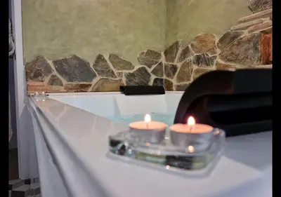 two candles sitting on top of a table at Alojamientos Segóbriga Rural ( Mandil) in Segorbe