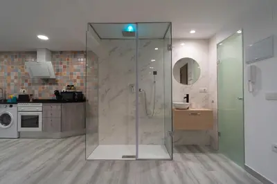 a bathroom with a glass shower with a sink at Sensaciones in Anna