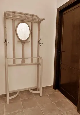 a room with a shelf and a mirror on the wall at PALACIO Boutique in Anna