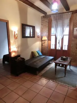a living room with a couch and a table at Total Valencia Charming in Valencia