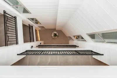 a staircase in a building with a white ceiling at Mon Suites Benlliure in Valencia
