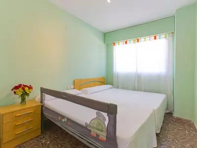 a bedroom with two beds and a dresser and a window at Apartment Ana by Interhome in Cullera