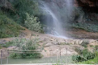a suspension bridge in front of a waterfall at Casa de Pueblo El Patio de las Cebollas in Segorbe