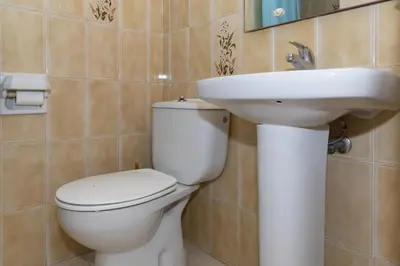 a bathroom with a toilet and a sink at El Raco, A-7-13 in Cullera