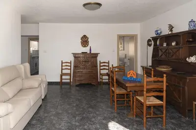 a living room with a couch and a table and chairs at El Raco, B-8-15 in Cullera