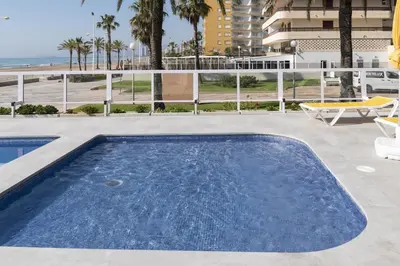 a swimming pool with a view of the ocean at Florazar-3, 14-E in Cullera