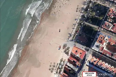 an aerial view of a beach with a group of people at Ático a 100 metros de la playa in Cullera
