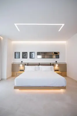 a living room with a bed and a dining room at MYR Puerta Serranos in Valencia