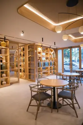 a tasting room with tables and chairs and wine racks at MYR Puerta Serranos in Valencia