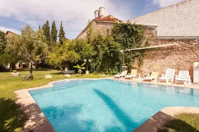 a swimming pool in the yard of a house at Villa Charly Casa señorial XVII Historical Villa in Macastre