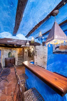 a bar in a blue room with a blue ceiling at Casa Museo RAKKANA - En el Centro de Requena in Requena