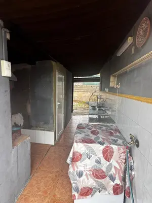 a room with a bed in the back of a building at Villa Barby in Lliria