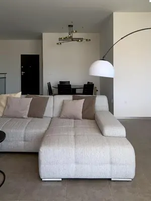 a living room with a couch and a table at Villa with magnificants sea views on Cullera bay. in Faro de Cullera