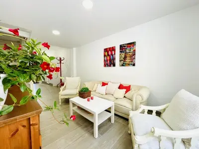 a living room with a couch and a table at JERICA ALOHA in Jérica