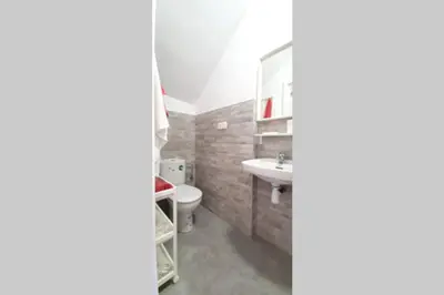 a bathroom with a sink and a toilet and a mirror at JERICA ALOHA in Jérica