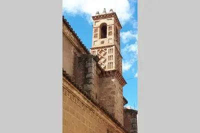 a clock tower on the side of a building at JERICA ALOHA in Jérica