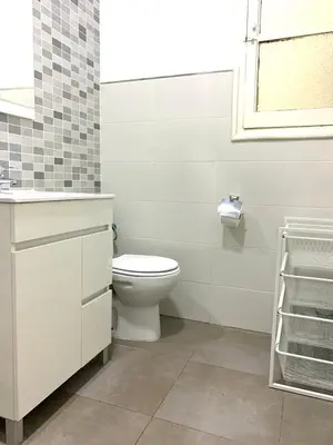 a bathroom with a toilet and a sink and a window at 2 Apartamento TERRAZA Free Wifi in Valencia