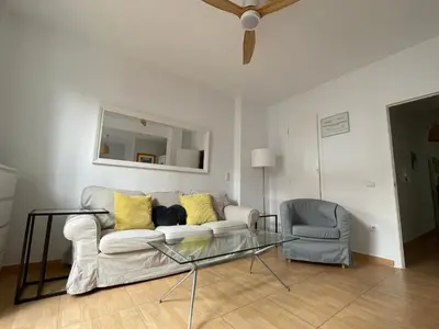 a living room with a couch and a glass table at 2 Apartamento TERRAZA Free Wifi in Valencia