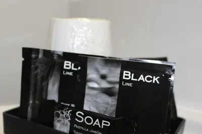a package of black line soap in a holder at Hostal Rural Fidel Garcia Guzman in Chera