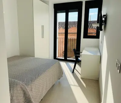 a kitchen with white cabinets and a green counter top at STUDIO Palomar - PalomarGroup in Alfara del Patriarca