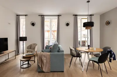 a living room with a couch and a table at Líbere Valencia Abastos in Valencia