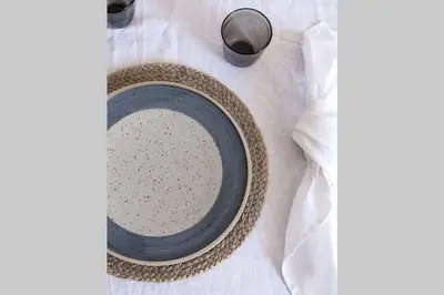 a plate and a bottle of milk on a table at UIM Mediterraneo Poeta 1 Wifi in Puerto de Sagunto