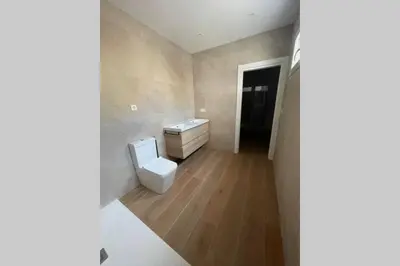 a bathroom with a toilet and a sink at UIM Mediterraneo CASA Plomo Wifi in Puerto de Sagunto