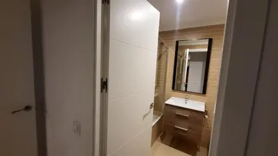 a bathroom with a sink and a mirror at BioHomeValencia in Valencia