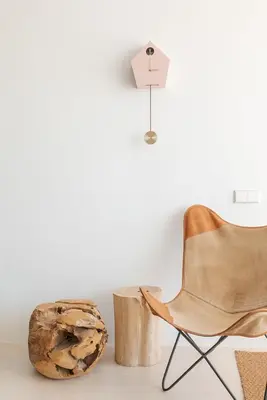 a chair and a wooden stump next to a table at Marsalada - Ground floor front line beach apartment in Playa de Mar